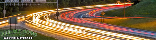 the blur of traffic around a bend of a birmingham highway
