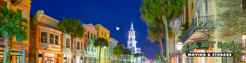 buildings and church in downtown bluffton, south carolina with the moon in the night sky