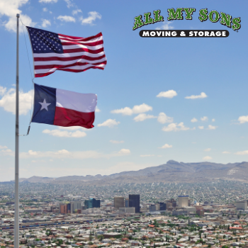 The Texas state flag and the American flag fly over El Paso, Texas.