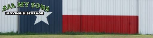 A large Texas state flag on the side of a building.