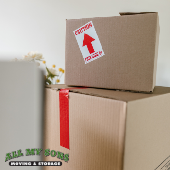 stack of boxes with the All My Sons Moving & Storage logo
