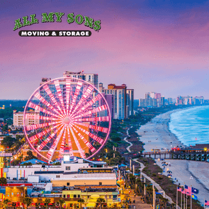 Neon ferris wheel at the boardwalk along Myrtle beach skyline at sunset