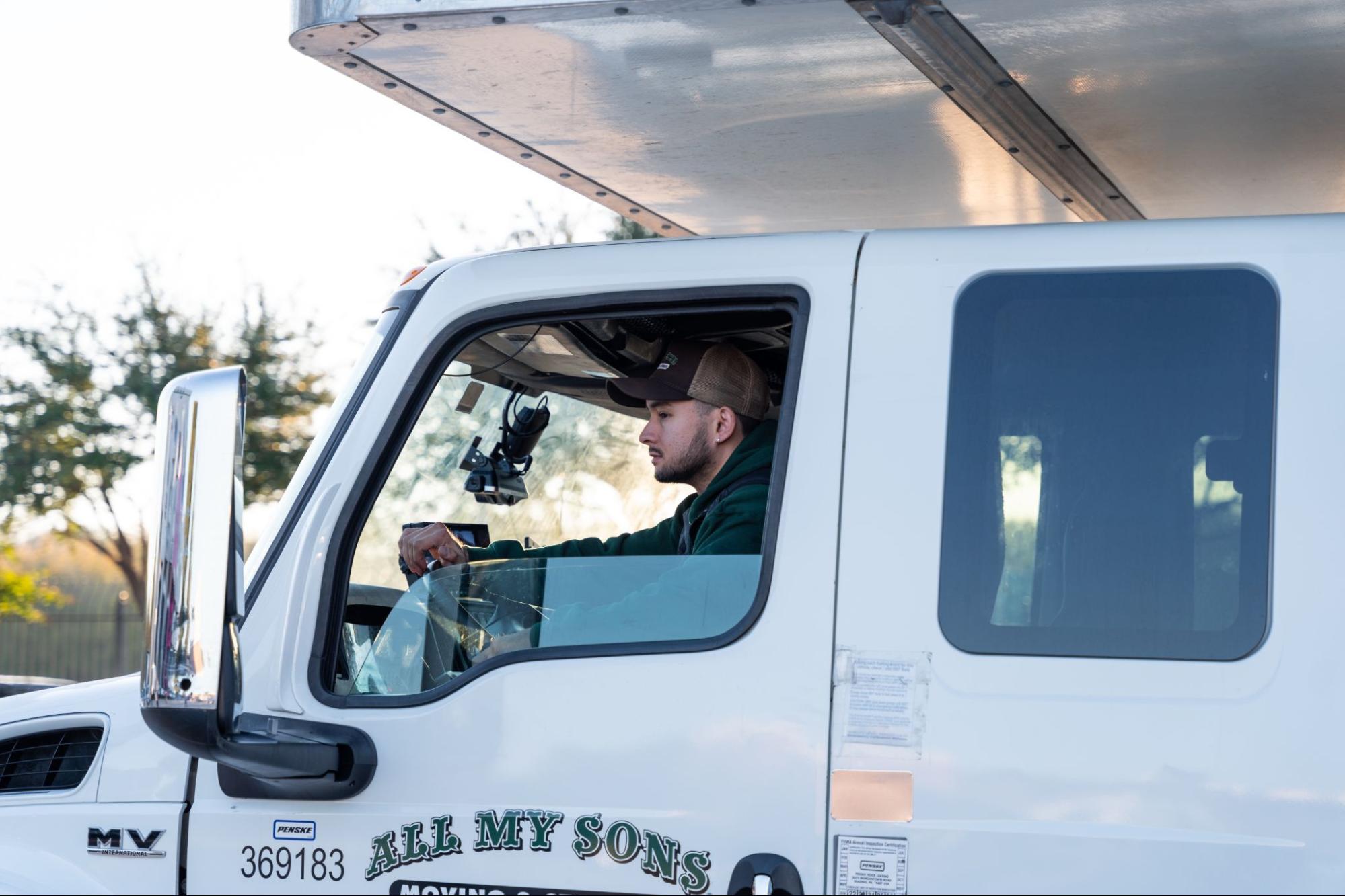 All My Sons professional moving truck driver navigates the local terrain.