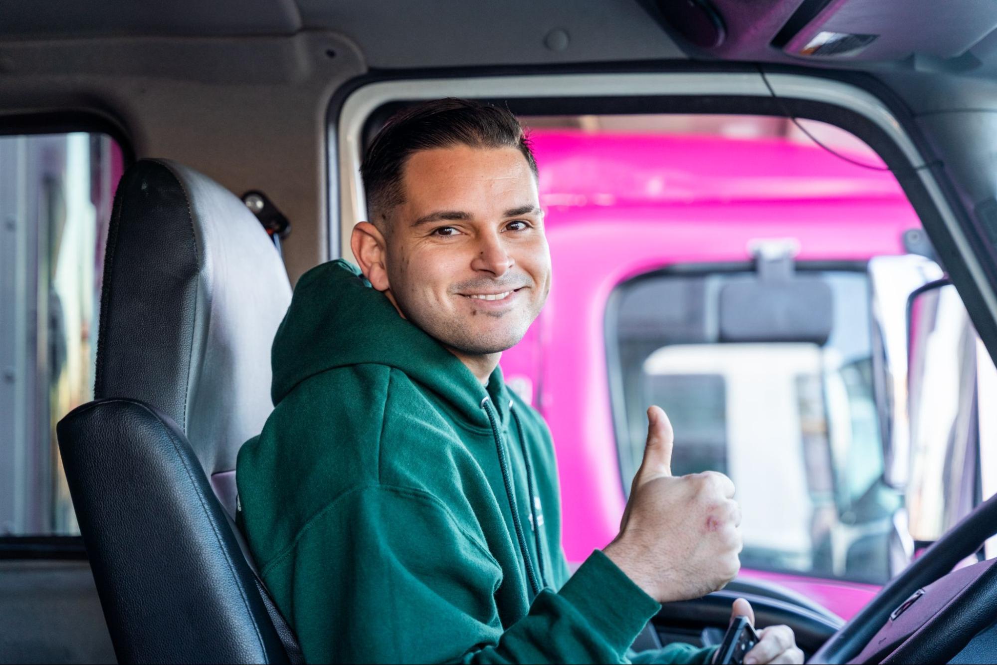 A professional mover with All My Sons flashes a thumbs-up to signal another efficient move.